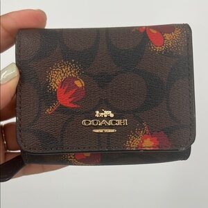 Coach Brown Wallet with Red and Yellow Floral Accents